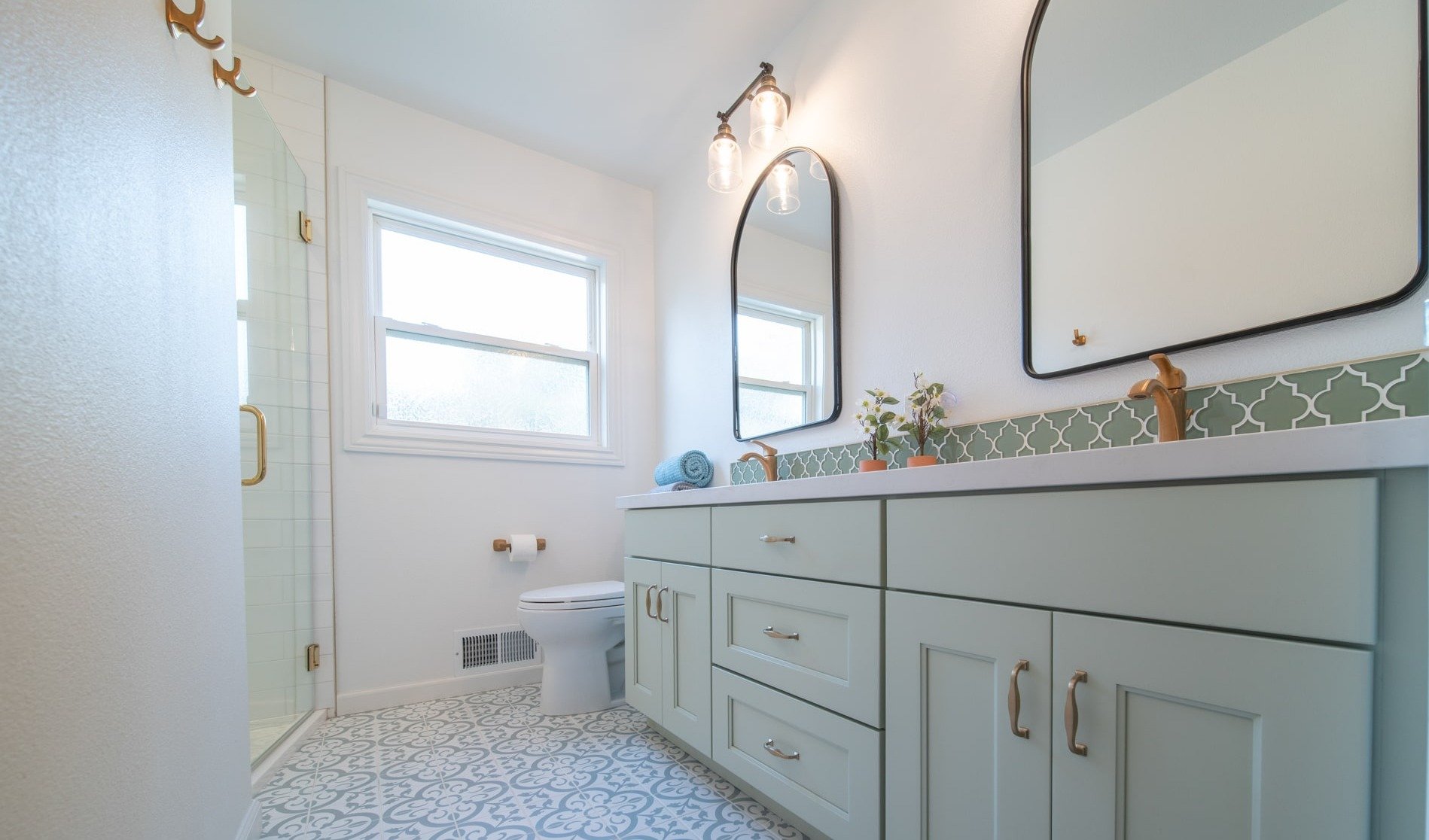 Brushed gold faucets on bathroom sink in fresno-1