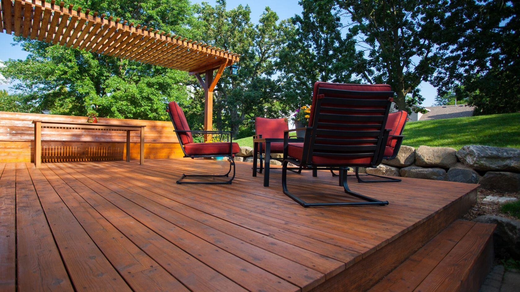 Outdoor deck space with steps and pergola